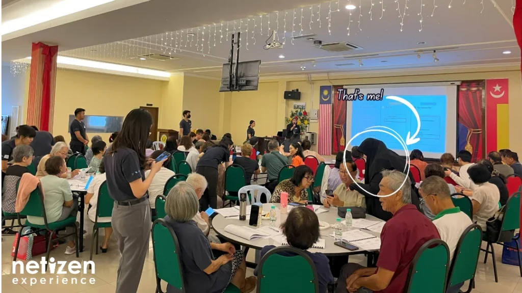 Tech workshop with elderlies getting them to be more comfortable with their phones and triggering emergency sos, also showcasing the author in action